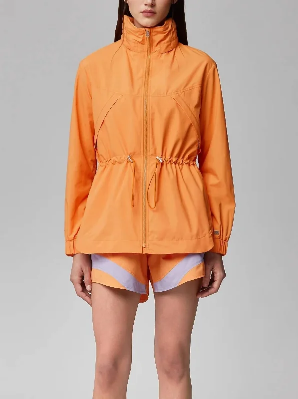 Raven Hooded Rainwear Coat In Melon